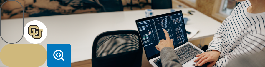 Pointing at a computer screen and reading about the Colorado's Cybersecurity Ecosystem